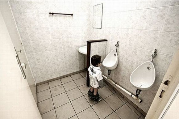 little boy in a man toilet
